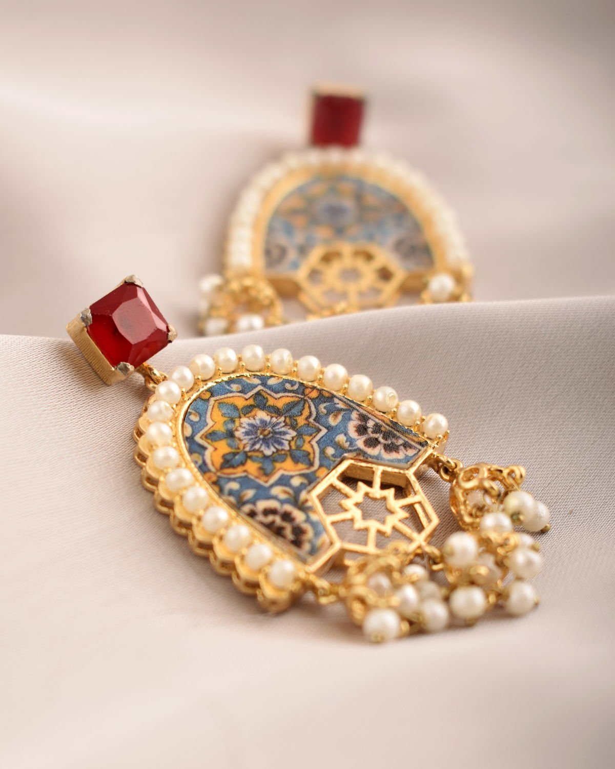 Detail view of the arched Arabesque Earrings, from the Arabesque collection.