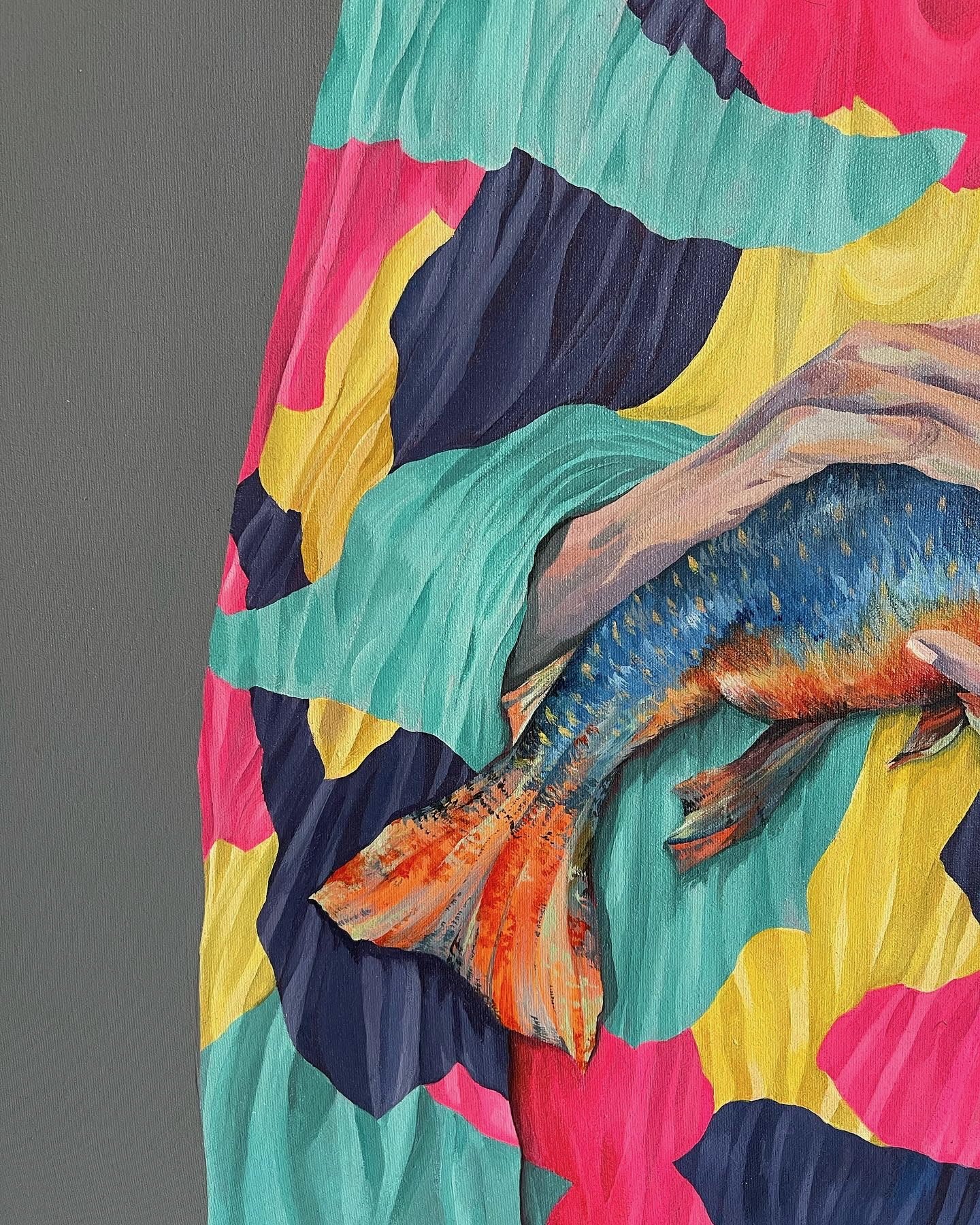 Detail of Woman with Fish, showing the hands holding the fish against folds of pink, yellow and teal.