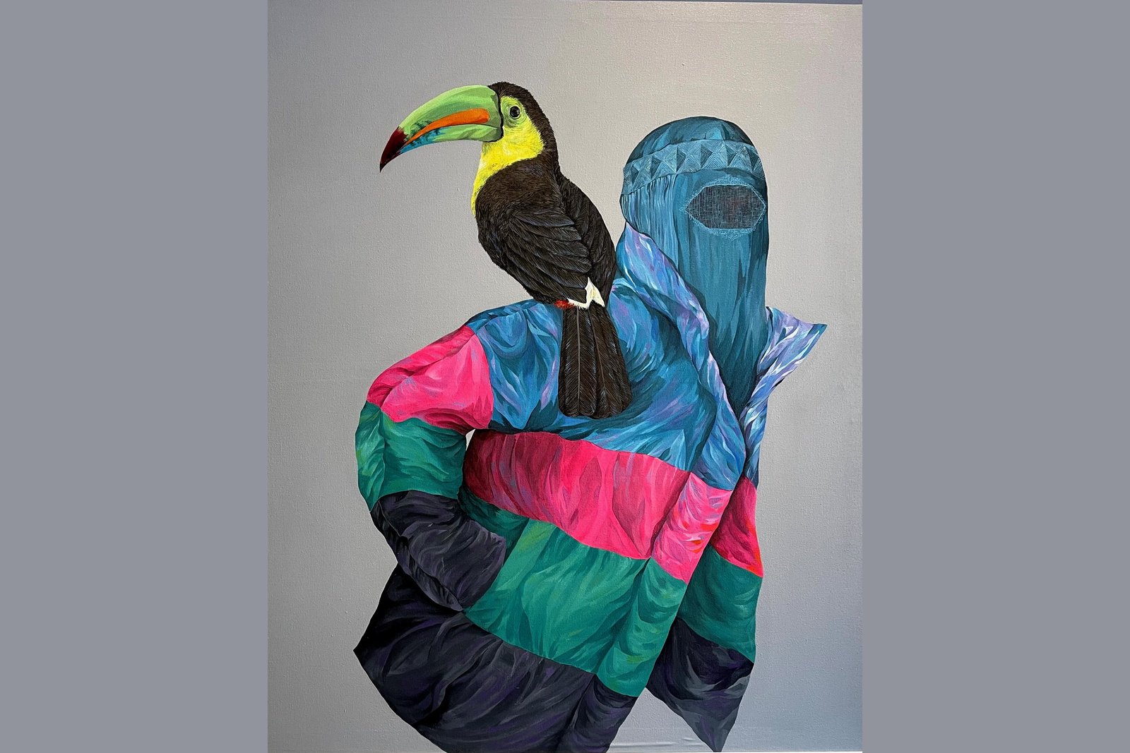 Woman with Toucan: an acrylic canvas of a figure in a blue veil and a colourful padded jacket, with a keel-billed toucan perched on the shoulder.