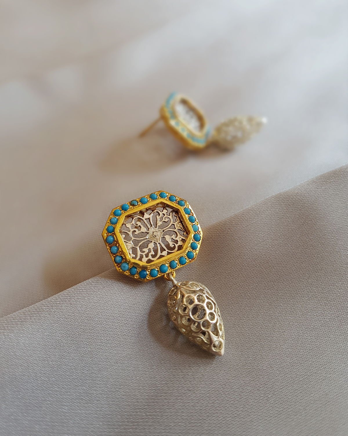 Detail view of the jaali Filigree Earrings with Turquoise, from the Filigree collection.