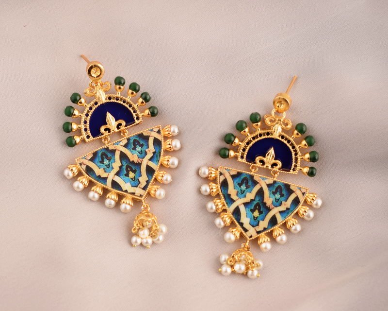 A pair of Blue-Green Arabesque earrings: navy enamelled crescents edged with green beads above blue and turquoise tile panels, pearl borders and pearl jhumka drops.
