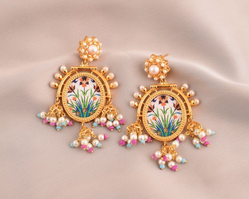 A pair of Floral Arabesque earrings with hand-painted oval panels of irises, pearl-cluster tops and fringes of pearls with pink and blue beads.