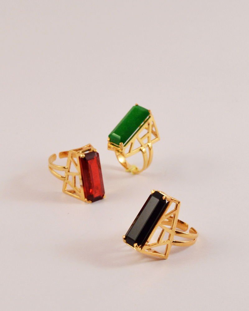 Three Statement Rings with open lattice cages set with green jade, red zircon and black onyx.