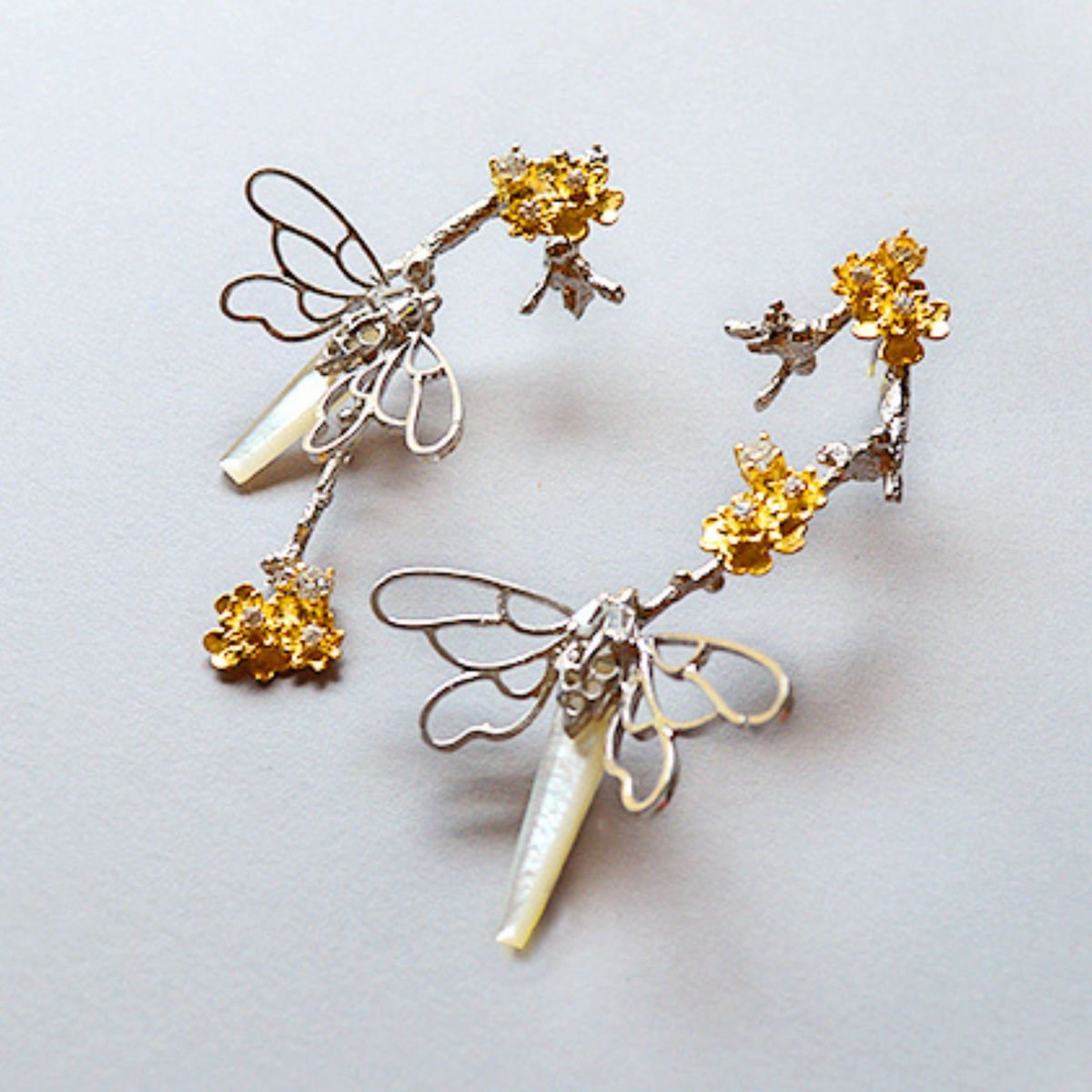 Butterfly Twig Earrings with Mother of Pearl and Zircons, from the Lei collection.