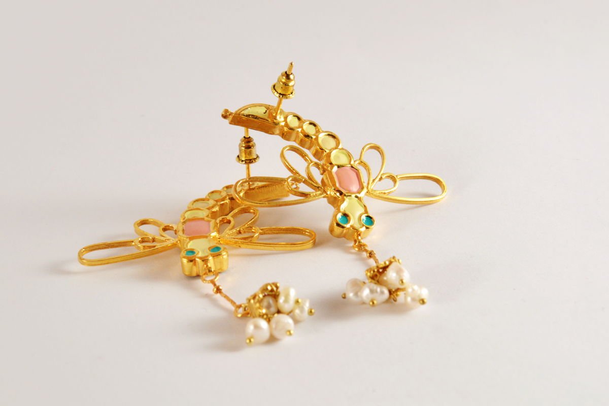 Detail view of the curved Dragonfly earrings, from the Safari collection.