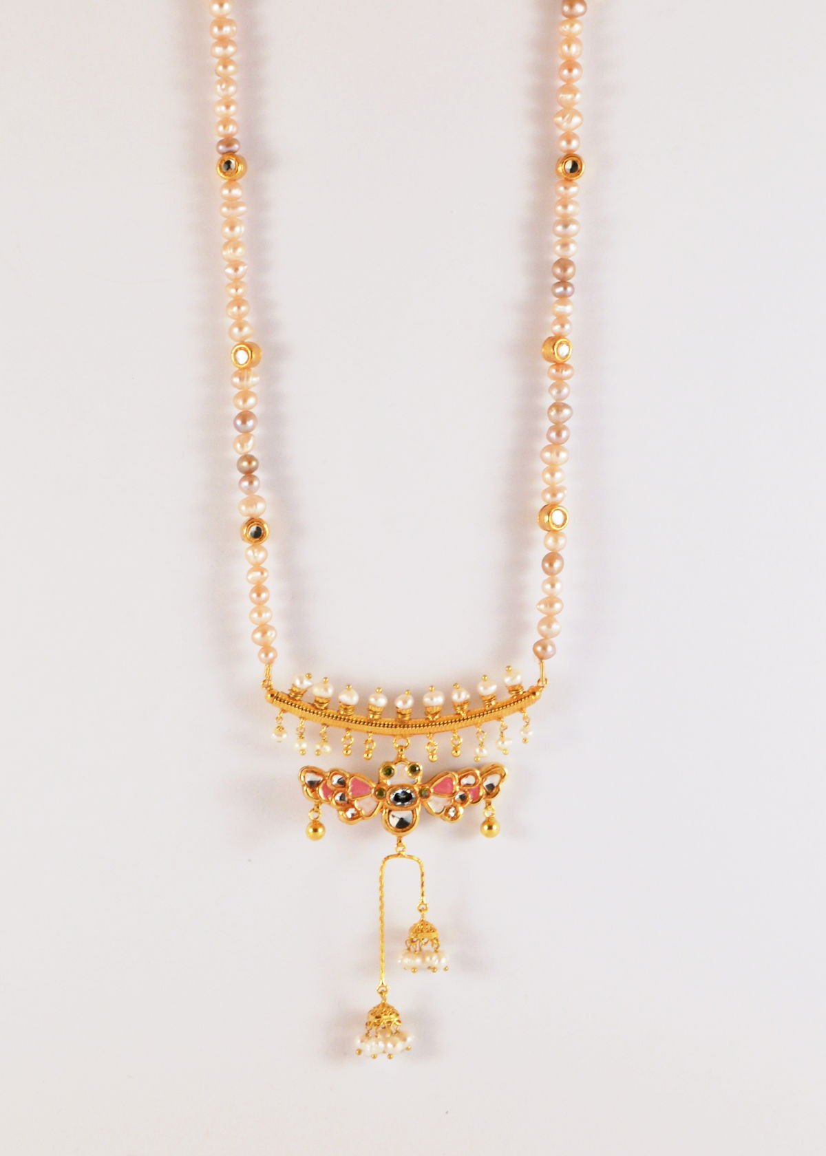 Butterfly necklace with kundan and enamel detail on front and back, from the Safari collection.