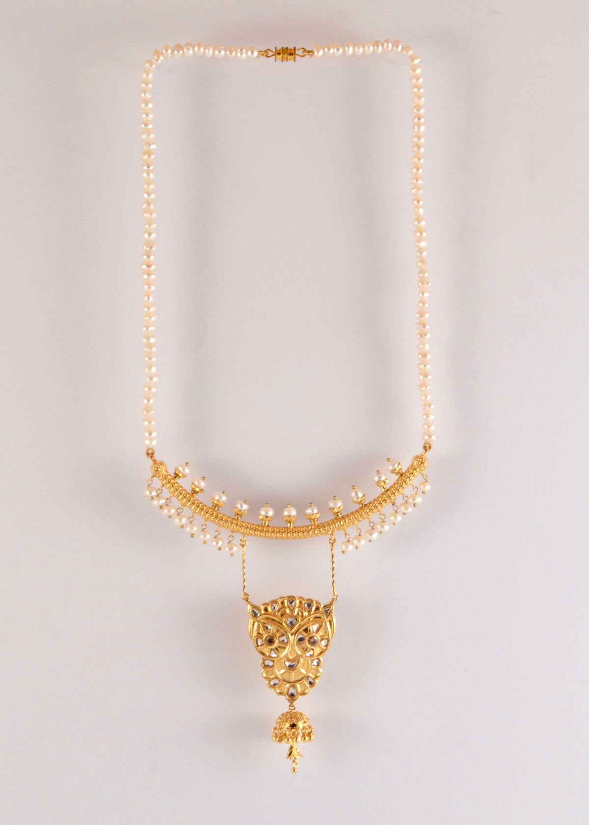 Owl necklace with pearls and jhumka drop, from the Safari collection.
